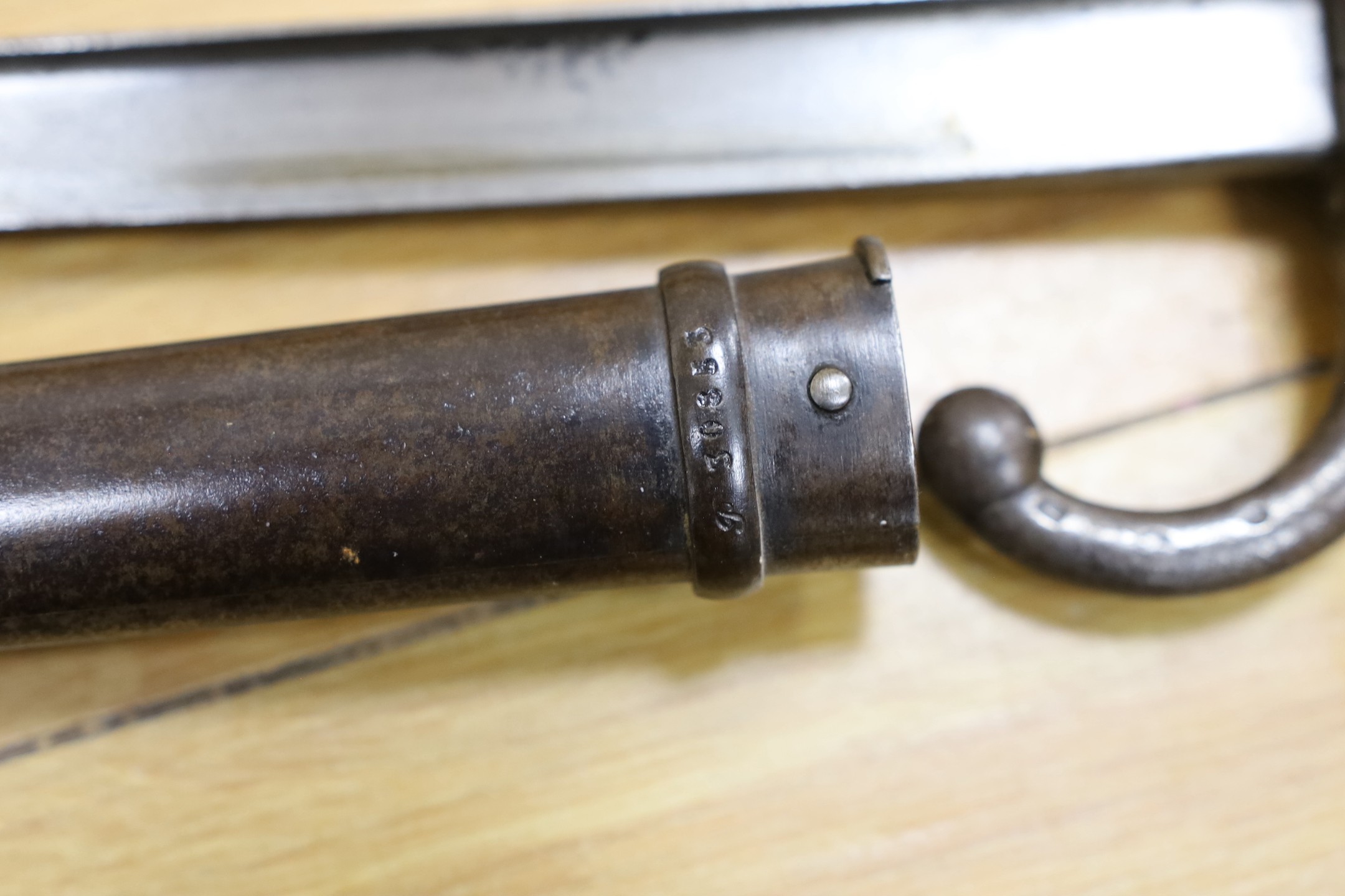 A Victorian officer's sword, lacking sheath, together with a 19th century French ’1877’ bayonet and sheath